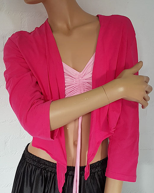 Buikdans top in fuchsia met driekwart mouw.