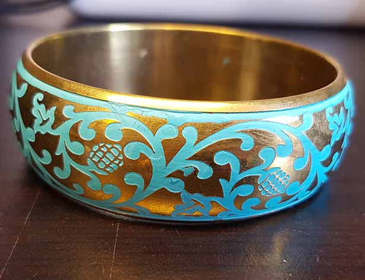 Goudkleurige armband met turquoise elementen